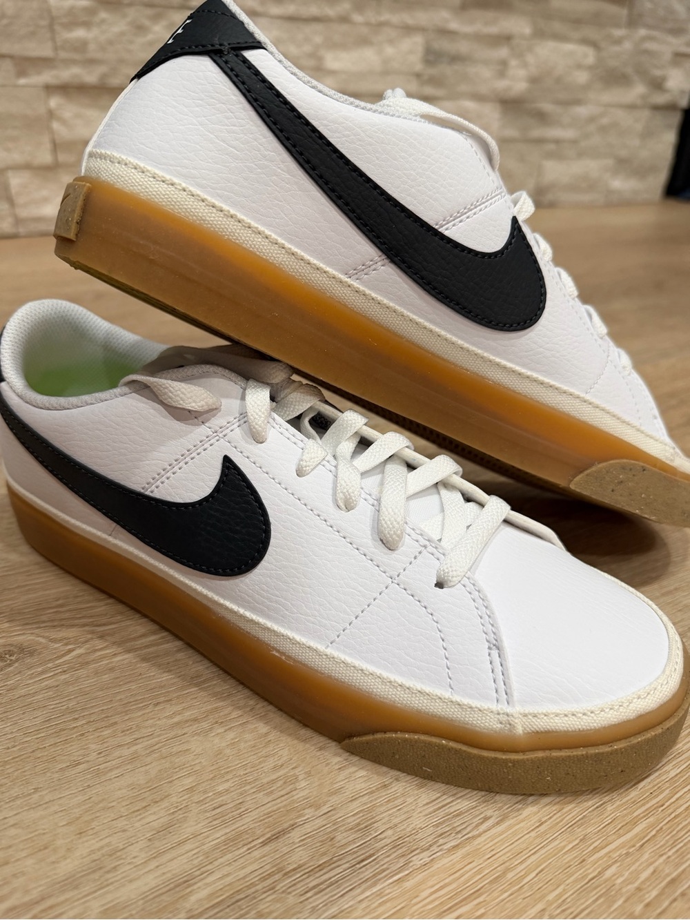 Nike Women's White Sneakers with Black Swoosh and Gum Sole